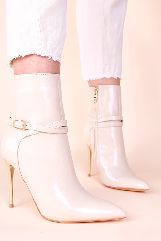 Bottines sable sur talon doré avec...