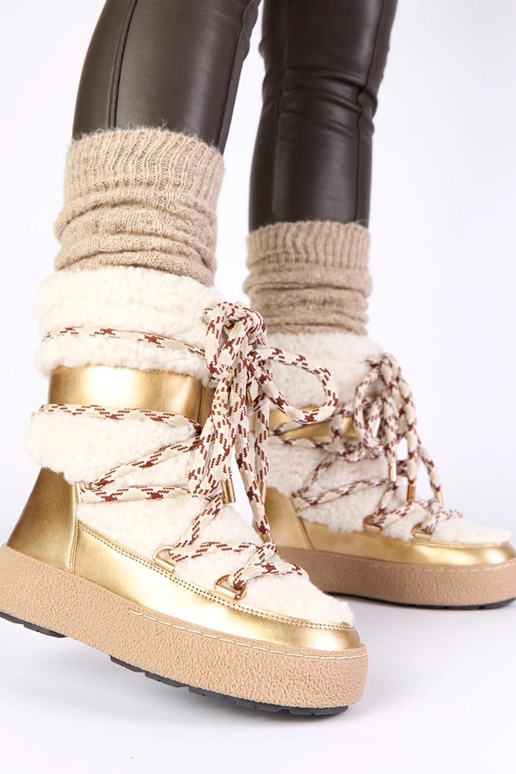 Bottes de neige à lacets dorées et...