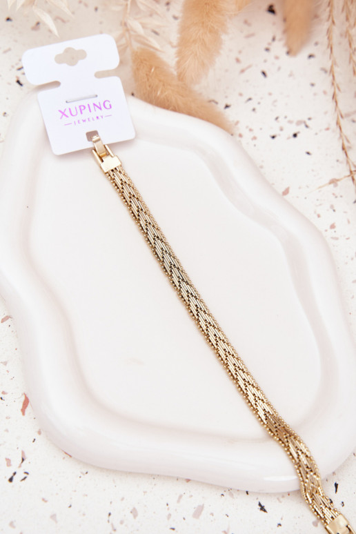 Un bracelet Féminin couleur dorée