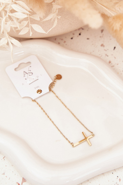 Un bracelet Avec une croix Stal Chirurgiczna couleur dorée