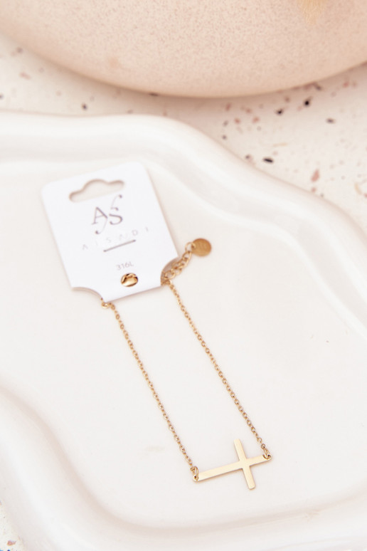 Un bracelet Avec une croix Stal Chirurgiczna couleur dorée