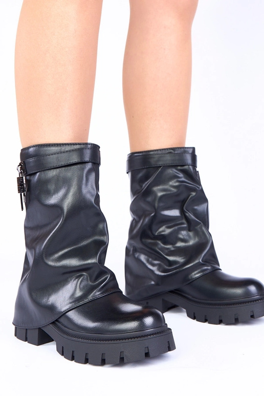 Bottes noires à plateforme et coude...