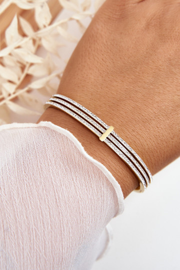 Un bracelet en acier inoxydable avec des yeux qui clignotent couleur dorée