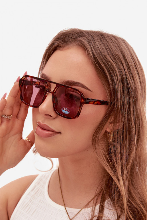 Des lunettes de soleil Féminin brun-couleur rose