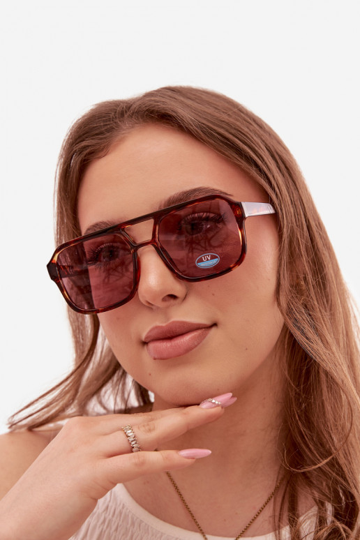 Des lunettes de soleil Féminin brun-couleur rose