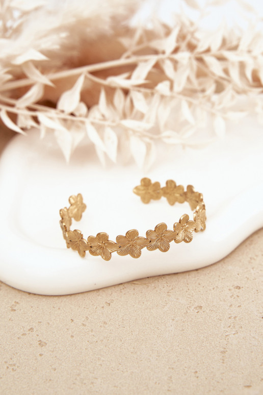 Un bracelet Féminin en acier inoxydable avec des motifs florauxuszki couleur dorée