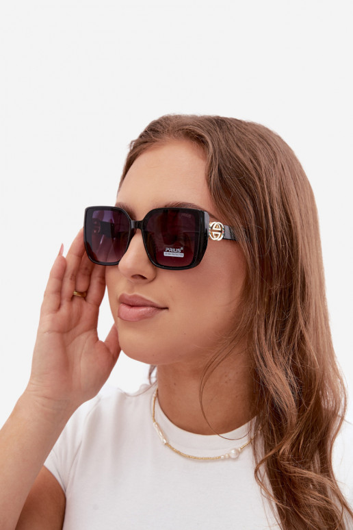Lunettes de soleil avec des détails décoratifs en couleur noire