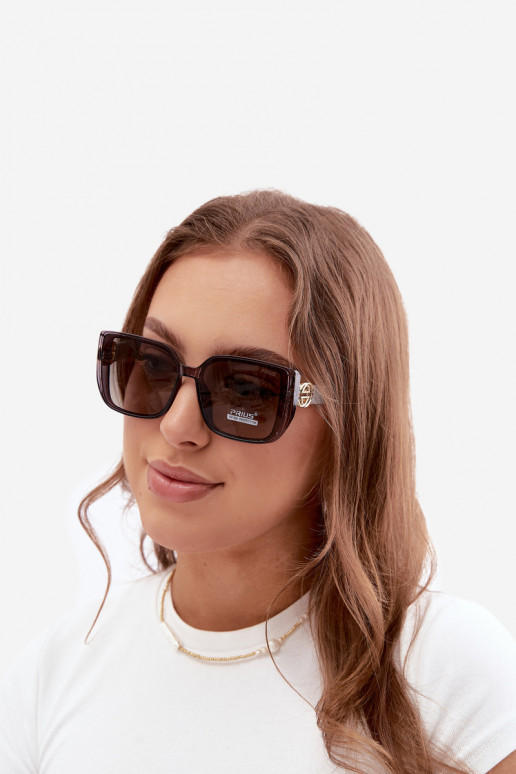 Lunettes de soleil avec des détails décoratifs en couleur grise