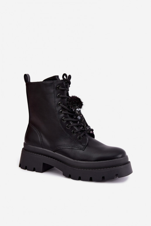 bottes isolées avec pompons en noir Faresse