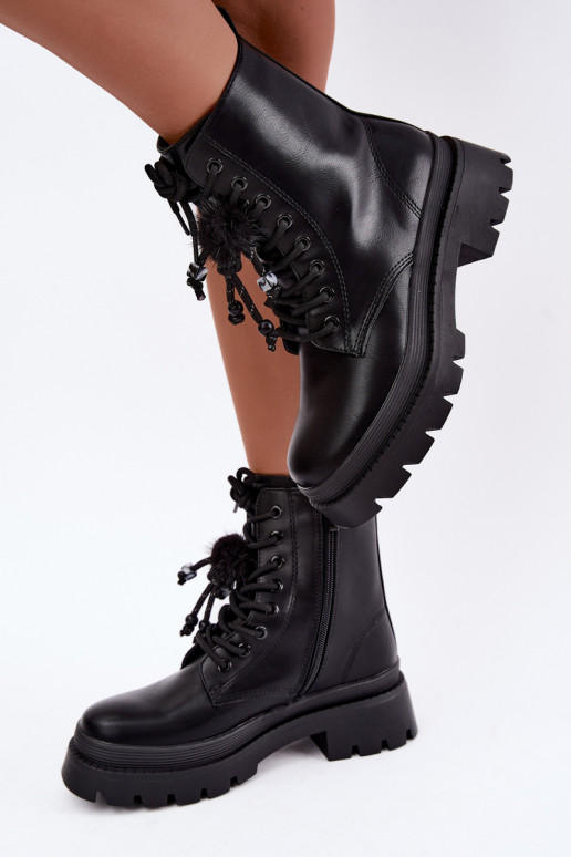 bottes isolées avec pompons en noir Faresse