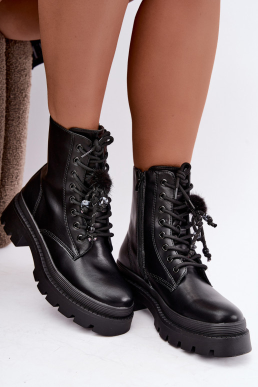 bottes isolées avec pompons en noir Faresse