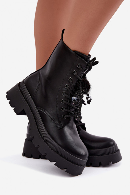 bottes isolées avec pompons en noir Faresse