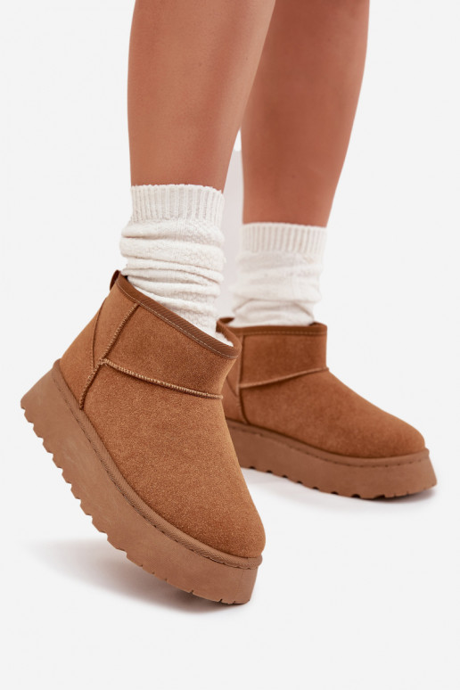 Chaussures beige avec accents noirs et semelle épaisse