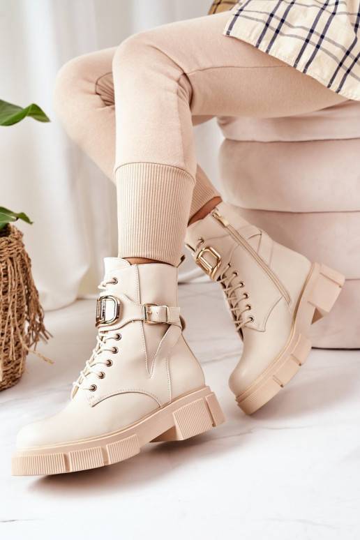 Bottes chauffantes à boucles dorées en beige