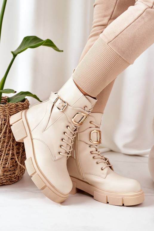 Bottes chauffantes à boucles dorées en beige