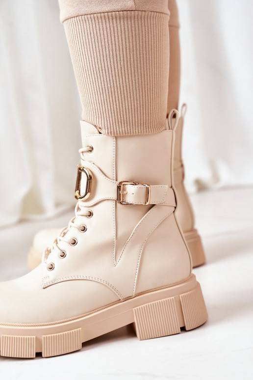 Bottes chauffantes à boucles dorées en beige