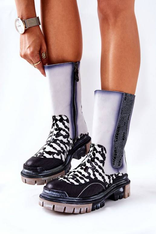 Bottes élégantes noires et blanches Bottes élégantes noires et blanches