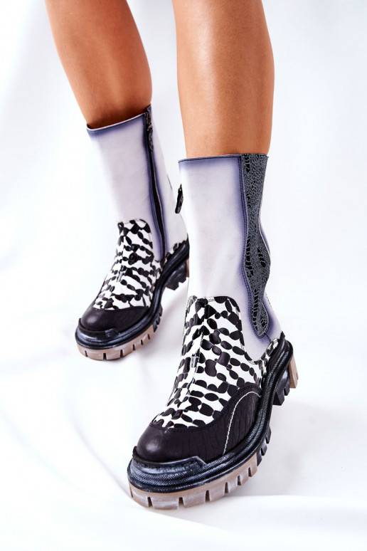 Bottes élégantes noires et blanches Bottes élégantes noires et blanches