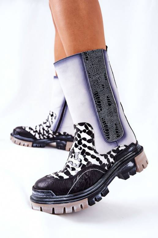 Bottes élégantes noires et blanches Bottes élégantes noires et blanches
