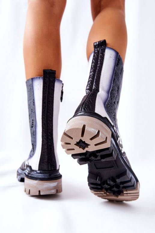 Bottes élégantes noires et blanches Bottes élégantes noires et blanches