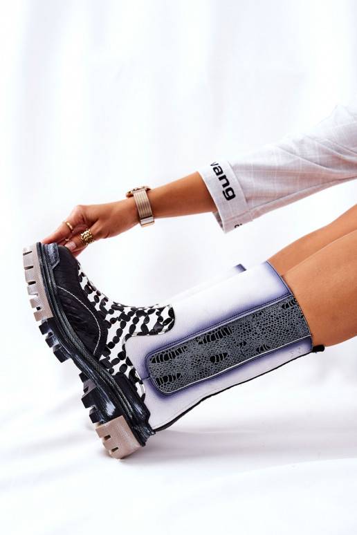 Bottes élégantes noires et blanches Bottes élégantes noires et blanches