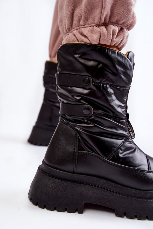 Bottes de neige noires avec... Bottes de neige noires avec...
