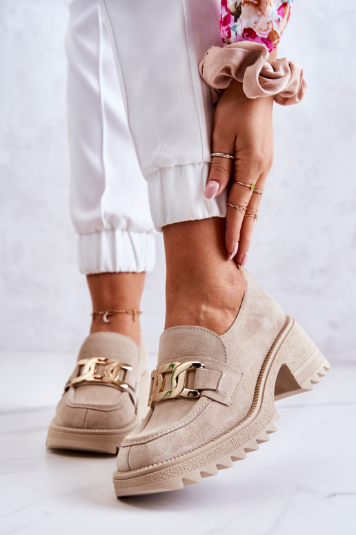 Boots en daim ivoire avec détails... Boots en daim ivoire avec détails...