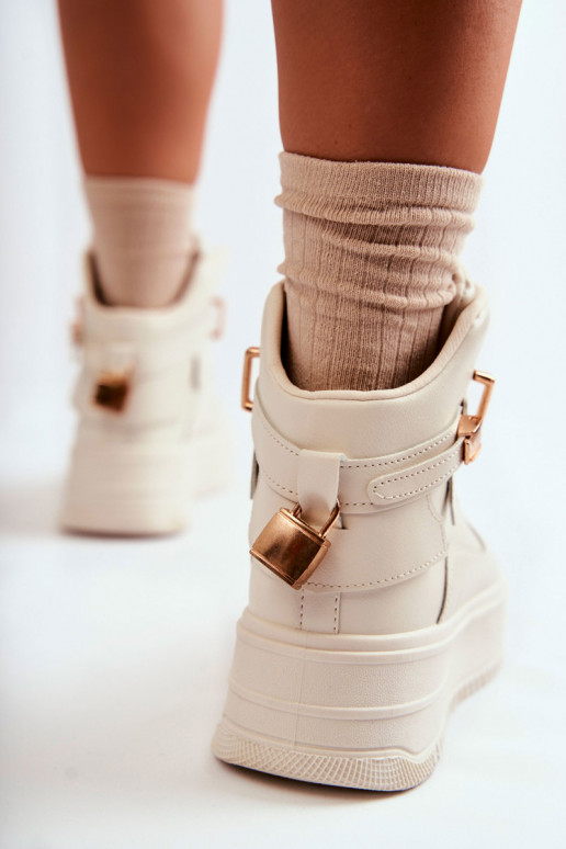 Chaussures de sport chauffantes beige... Chaussures de sport chauffantes beige...