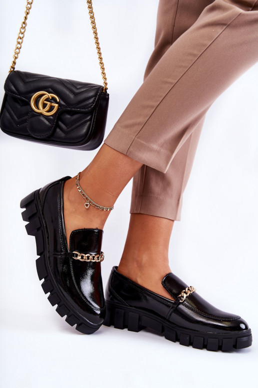 bottes en cuir verni avec chaînes en noir Anne