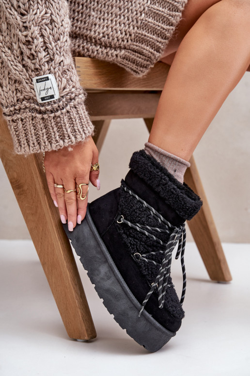 Bottes de neige avec une plateforme et des détails élégants couleur noire Izathiel Bottes de neige avec une plateforme et des détails élégants couleur noire Izathiel