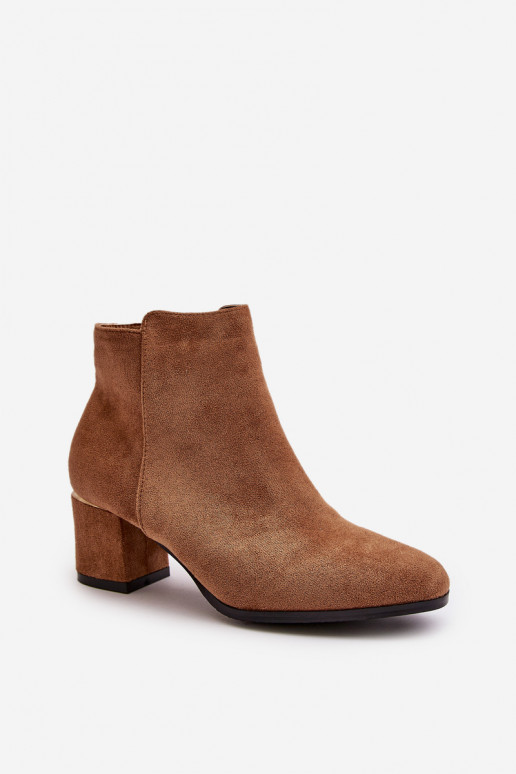 Bottines à talon en daim synthétique... Bottines à talon en daim synthétique...