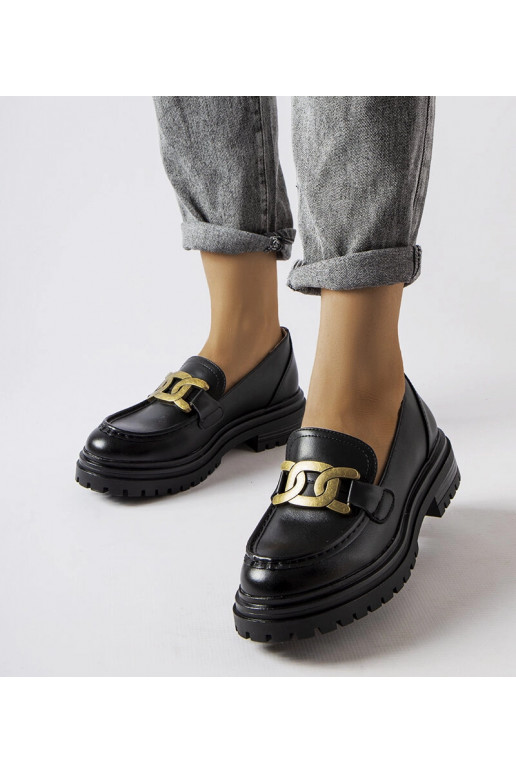 Mocassins noirs décorés d'une boucle...