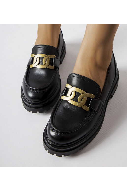 Mocassins noirs décorés d'une boucle...