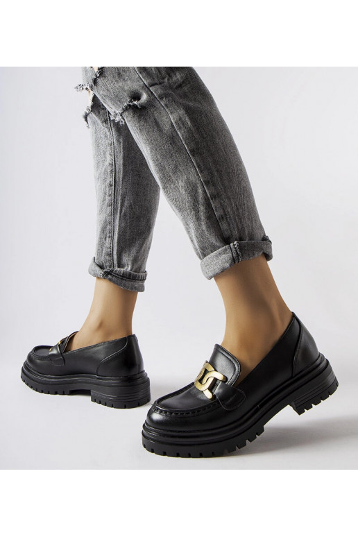 Mocassins noirs décorés d'une boucle...